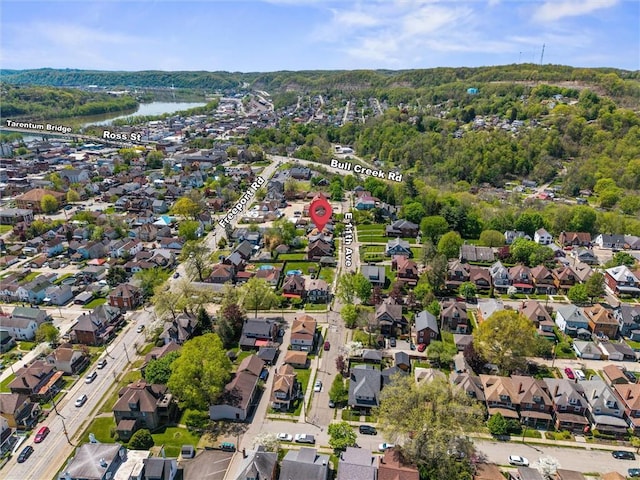 bird's eye view featuring a water view and a residential view