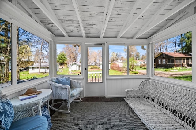 sunroom with beamed ceiling