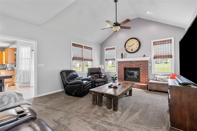 carpeted living area featuring a ceiling fan, baseboards, plenty of natural light, and a fireplace