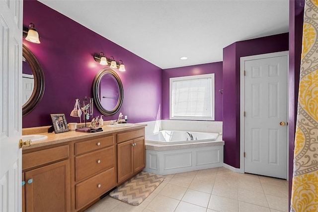 bathroom featuring double vanity, tile patterned floors, a sink, and a bath