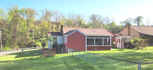 419 Streets Run Rd, Whitehall, PA 15236 - back of house featuring a sunroom, a fenced backyard, a shed, and a yard