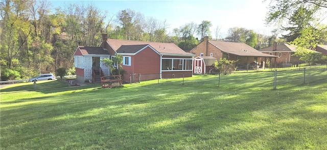 419 Streets Run Rd, Whitehall, PA 15236 - back of house with a lawn, fence, and a chimney
