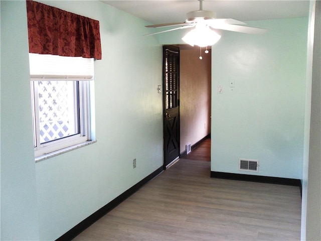 419 Streets Run Rd, Whitehall, PA 15236 - empty room featuring a ceiling fan, baseboards, visible vents, and wood finished floors