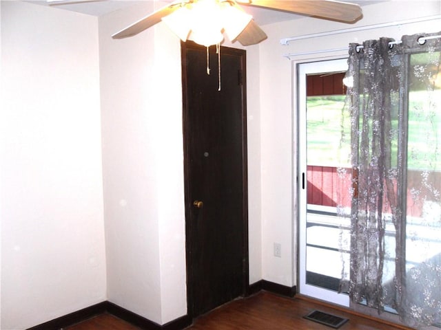 419 Streets Run Rd, Whitehall, PA 15236 - empty room featuring ceiling fan, visible vents, a wealth of natural light, and dark wood finished floors