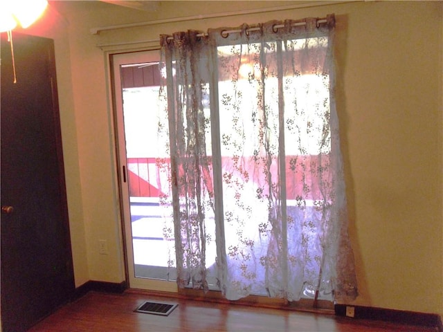 419 Streets Run Rd, Whitehall, PA 15236 - doorway with baseboards, visible vents, and wood finished floors