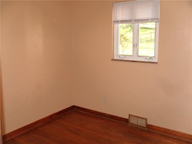 419 Streets Run Rd, Whitehall, PA 15236 - empty room with visible vents, dark wood-style flooring, and baseboards