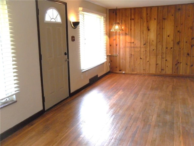 419 Streets Run Rd, Whitehall, PA 15236 - foyer entrance featuring wooden walls, baseboards, and wood finished floors