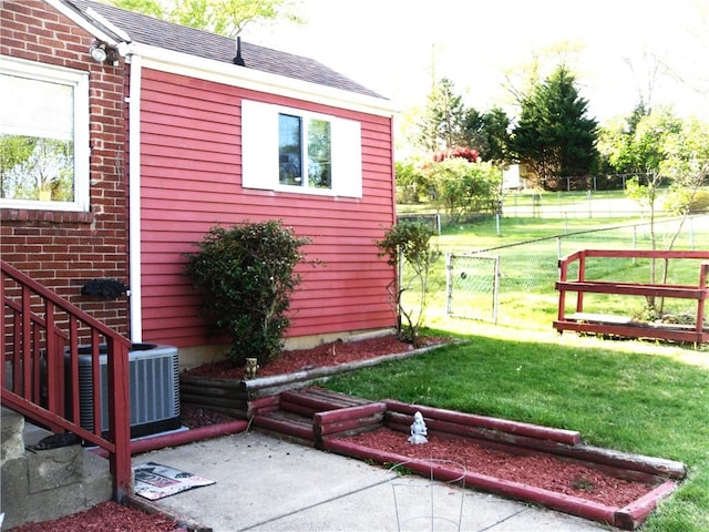 419 Streets Run Rd, Whitehall, PA 15236 - view of side of home featuring a lawn, central air condition unit, brick siding, and fence