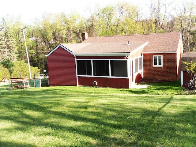 419 Streets Run Rd, Whitehall, PA 15236 - back of house featuring a chimney, roof with shingles, brick siding, fence, and a yard
