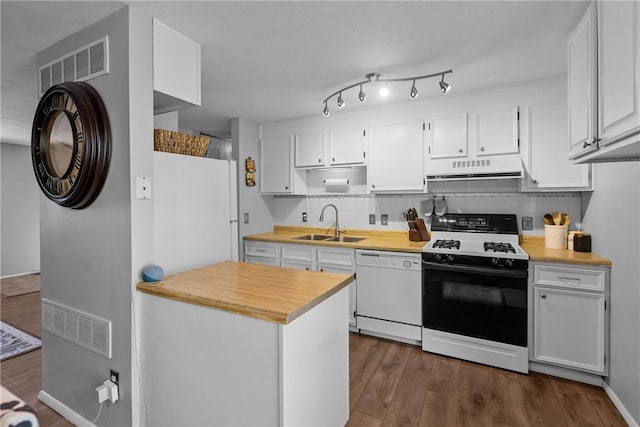 kitchen with range with gas cooktop, white dishwasher, light countertops, a sink, and under cabinet range hood