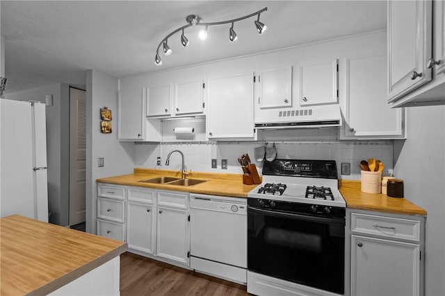 kitchen with white appliances, extractor fan, a sink, and light countertops