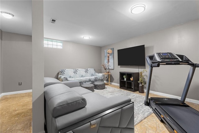 living room with baseboards and visible vents
