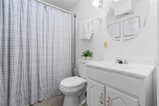 full bathroom with vanity, a shower with curtain, toilet, and visible vents
