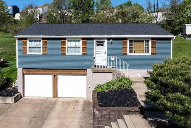 view of front of home featuring driveway and a garage