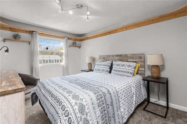 bedroom featuring baseboards and carpet flooring