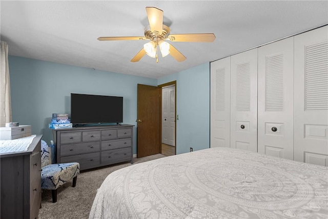 carpeted bedroom with a ceiling fan