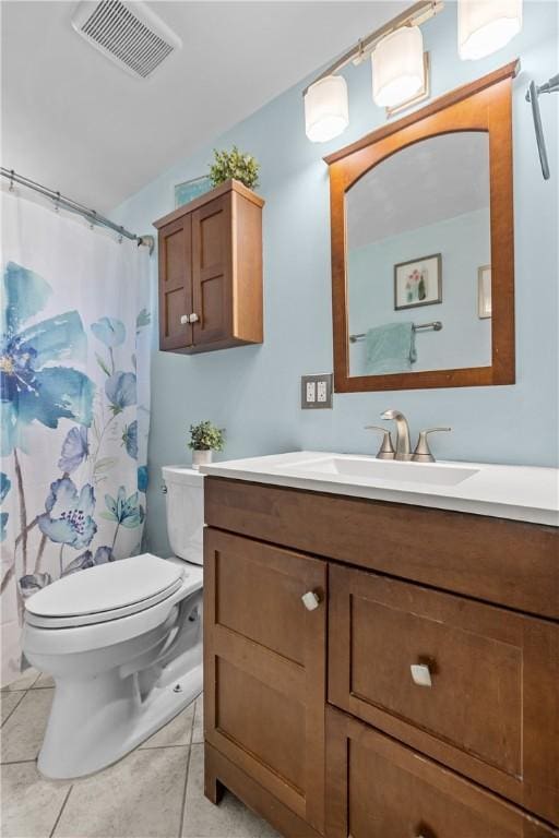 full bathroom featuring visible vents, vanity, toilet, a shower with shower curtain, and tile patterned floors