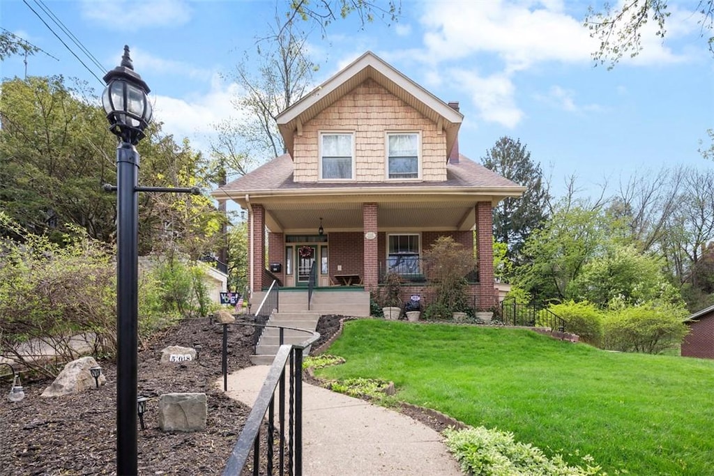 508 Cascade, Forest Hills Boro, PA 15221 - view of front of home featuring covered porch, brick siding, and a front lawn