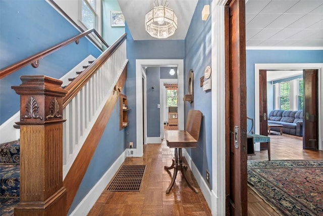 508 Cascade, Forest Hills Boro, PA 15221 - foyer featuring crown molding, visible vents, baseboards, stairway, and a notable chandelier