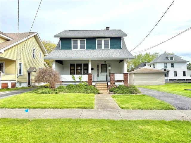 bungalow-style home featuring roof with shingles, covered porch, a chimney, and a front yard