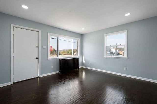 901 Union Ave, Mckeesport, PA 15132 - interior space featuring baseboards, recessed lighting, radiator, and wood finished floors