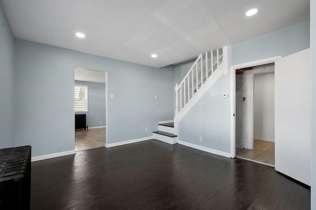 901 Union Ave, Mckeesport, PA 15132 - unfurnished living room with baseboards, recessed lighting, stairs, and wood finished floors