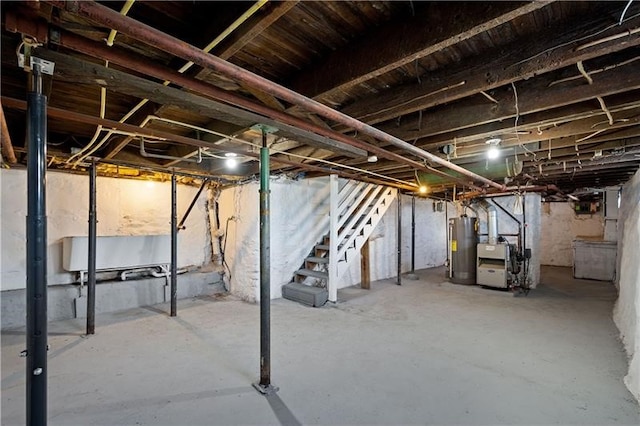 901 Union Ave, Mckeesport, PA 15132 - unfinished below grade area featuring water heater and stairway