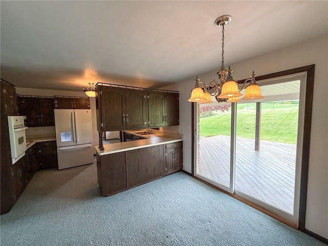 1194 Butler Rd, East Franklin Twp, PA 16262 - kitchen with white appliances, a chandelier, light carpet, a peninsula, and light countertops