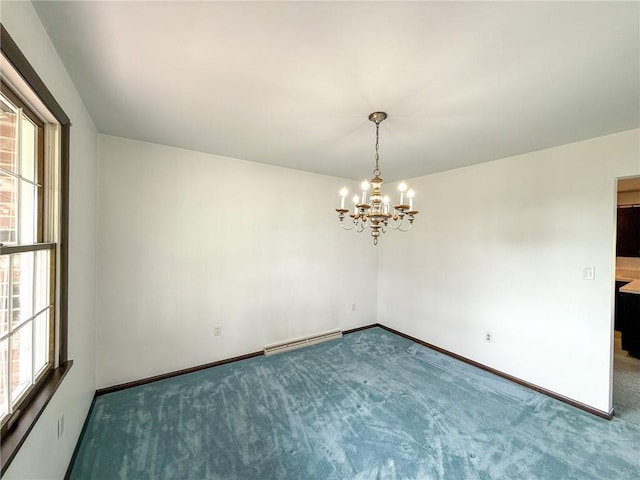 carpeted empty room with baseboards, a chandelier, and a healthy amount of sunlight