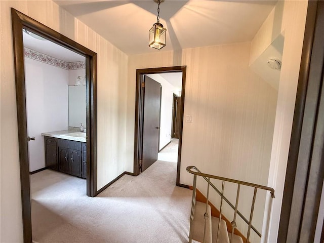 1194 Butler Rd, East Franklin Twp, PA 16262 - hall featuring a sink, light carpet, and baseboards