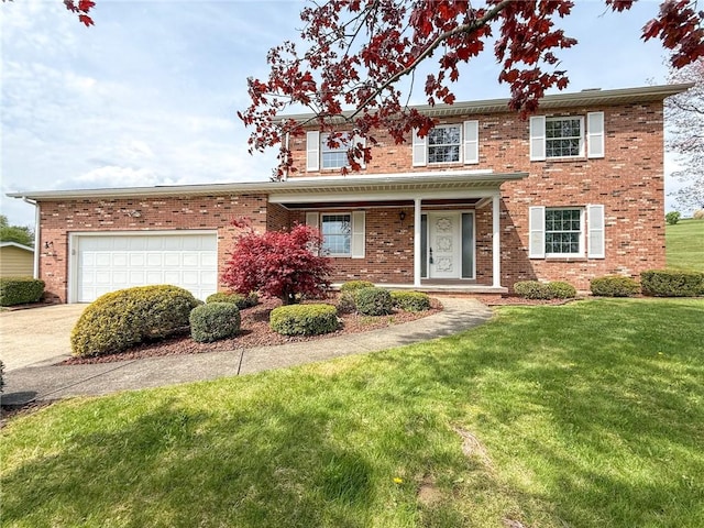 traditional home featuring brick siding, a garage, a front lawn, and concrete driveway