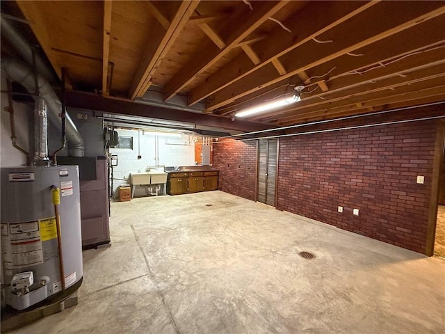 1194 Butler Rd, East Franklin Twp, PA 16262 - unfinished basement featuring water heater, brick wall, and a sink