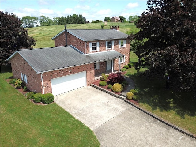 1194 Butler Rd, East Franklin Twp, PA 16262 - view of front of home featuring brick siding, concrete driveway, a front yard, and roof with shingles