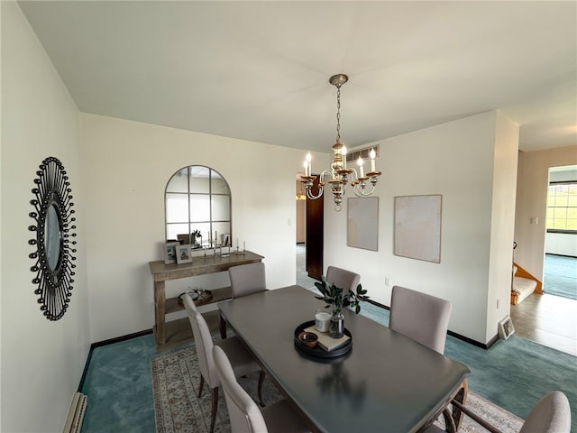 1194 Butler Rd, East Franklin Twp, PA 16262 - dining area with a chandelier, carpet flooring, and baseboards