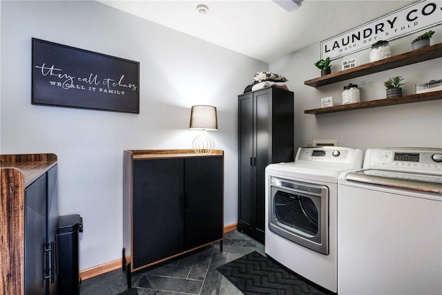 clothes washing area with laundry area, baseboards, and independent washer and dryer