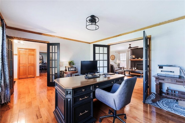 office area with ornamental molding, french doors, and light wood-type flooring