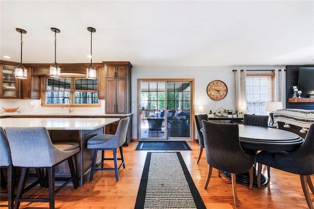 dining area featuring a healthy amount of sunlight and light wood-style flooring