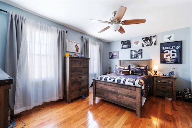 bedroom featuring ceiling fan and wood finished floors