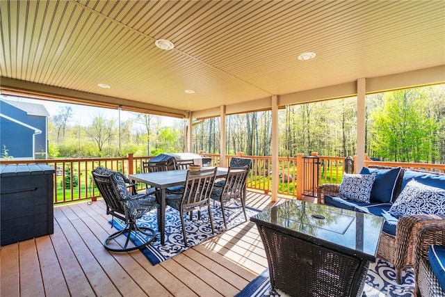 wooden deck featuring an outdoor hangout area and outdoor dining area