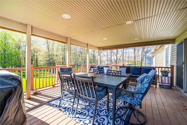 wooden deck featuring grilling area, outdoor lounge area, and outdoor dining space