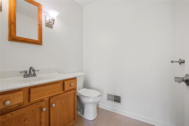 bathroom with visible vents, baseboards, tile patterned floors, vanity, and toilet