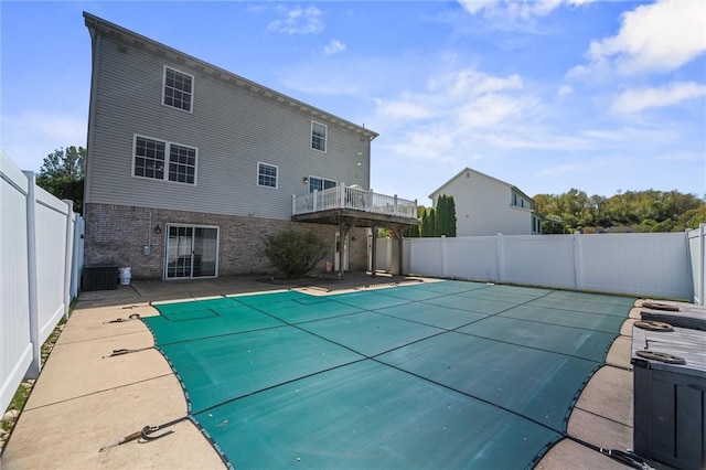 view of swimming pool featuring a patio, a fenced in pool, and a fenced backyard