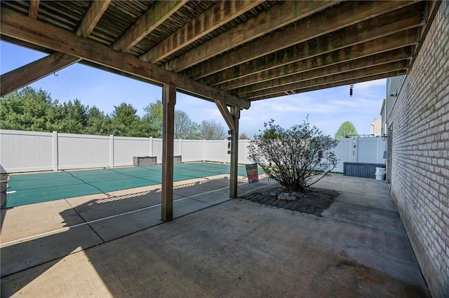 view of patio / terrace featuring fence