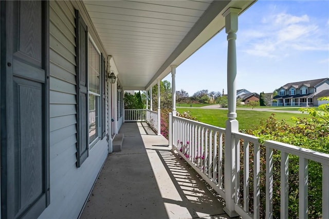view of patio / terrace featuring a residential view and covered porch