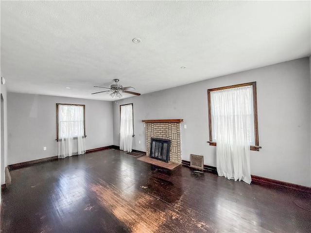 2103 Oriole Dr, Hopewell Twp Bea, PA 15001 - unfurnished living room with baseboards, a brick fireplace, and wood finished floors