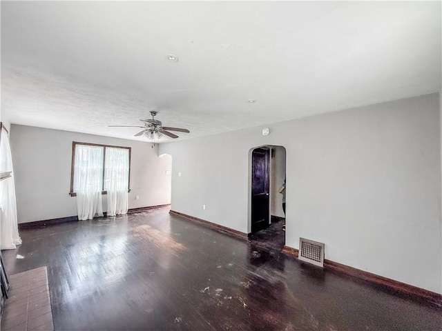 2103 Oriole Dr, Hopewell Twp Bea, PA 15001 - spare room featuring ceiling fan, visible vents, arched walkways, wood finished floors, and baseboards