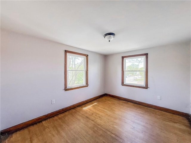 2103 Oriole Dr, Hopewell Twp Bea, PA 15001 - spare room featuring baseboards, a wealth of natural light, and light wood-style flooring