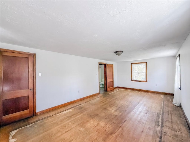 2103 Oriole Dr, Hopewell Twp Bea, PA 15001 - spare room with a textured ceiling, baseboards, and light wood-style flooring
