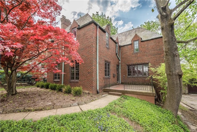 back of house with brick siding