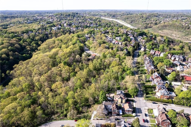 aerial view featuring a residential view and a wooded view